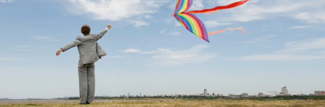 Business man flying kite